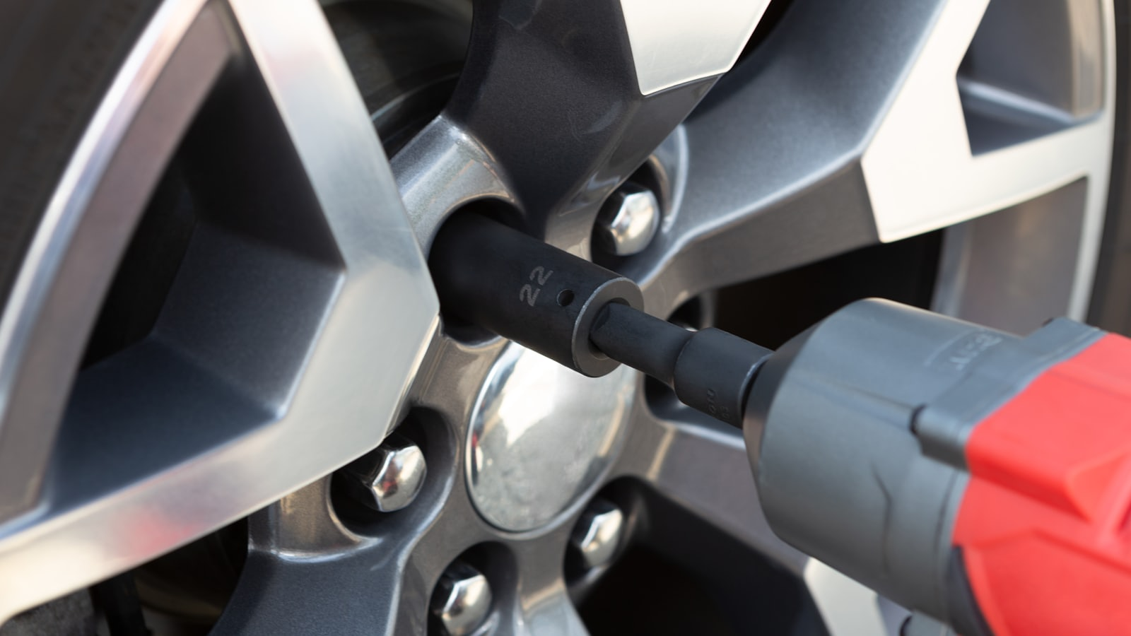A wheel being removed with an impact wrench during tyre work